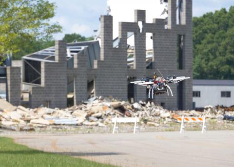 A team of engineers from Draper and MIT demonstrated a quadcopter that can navigate simulated urban environments and perform real-world tasks without human assistance. (Credit: DARPA)