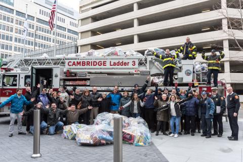 In raising the funds, Draper matched employees dollar for dollar, bringing in enough money to fill nine bins and three fire department vehicles with toys.